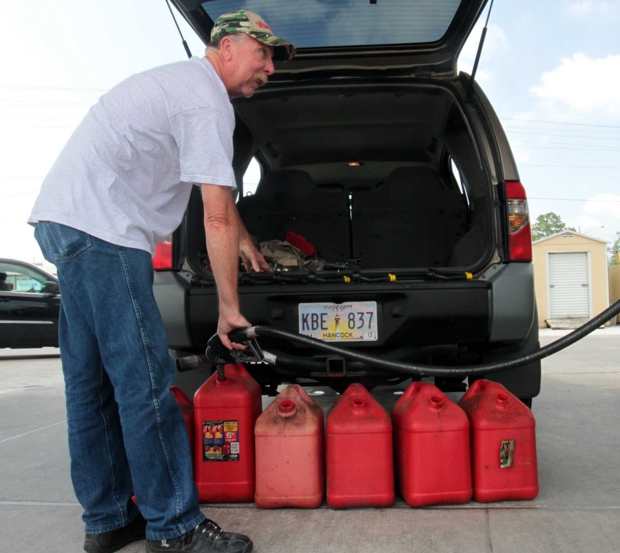J.D. Wood of Bay St. Louis, Mississippi, fills gas cans for his boat at the Walmart in Waveland, Mississippi, on Wednesday, May 9, 2012. (John Fitzhugh/Biloxi Sun Herald