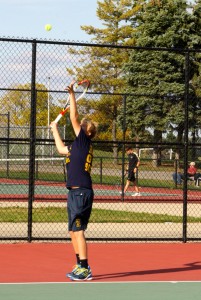 About to serve, Sophomore Alex Arnst uses all of his strength to win the the match. The varsity tennis team has a TVC conference meet October 