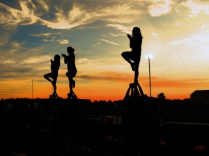 The cheerleaders motivate the boys of fall before and after sundown. | Photo by Maddie Putnam