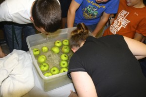 Jack Price and Jackie Wood compete in  apple bobbing at the Ag Olympics at the October FFA meeting.   