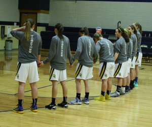 The Girls Varsity Basketball team stands giving attention to the flag before their game on Tuesday December 10th. Their next game is on Tuesday, December 17th at 6:00 pm. Come out and support your Marauder Varsity Girls Basketball | Photo by Marissa McOwen 