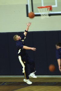 Luckhurst Chris goes up for a practice shot before the varsity game. | Photo by Michaela Post