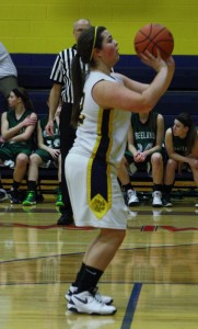 Sophomore Megan Ruff takes a shot to add to the score. | Photo by Linn Benham