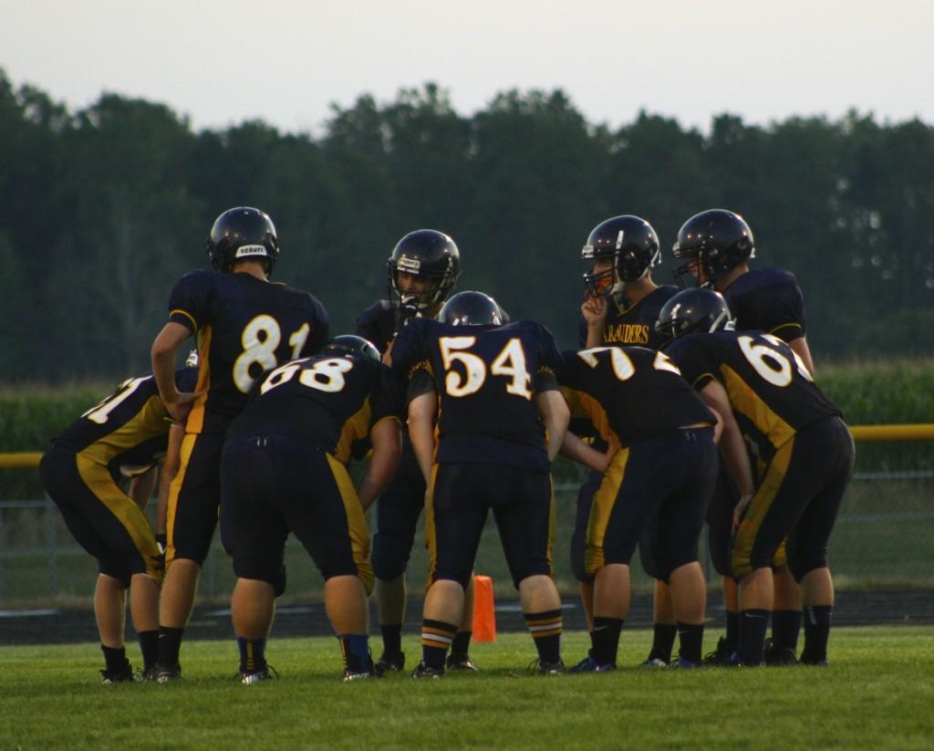 The+JV+football+team+huddles+to+prepare+for+the+next+play.+%7C+Photo+by+Allison+Patterson