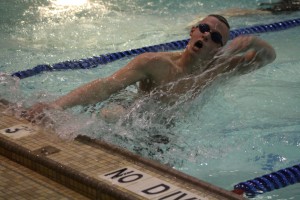 Sophomore Gage Cleveland swims in the last home meet for the 2013-2014 swim season. Gage is also involved in cross country and track. | Photo by Marrissa McOwen