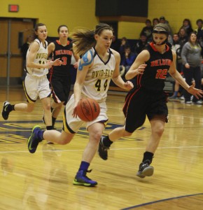 Sophomore Megan Walter runs the ball down the court for the Marauders. | Photo by Lindsay Benham