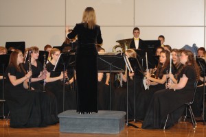 Mrs. Ignash conducting the High School band in their concert. | Photo by Lindsey Benham