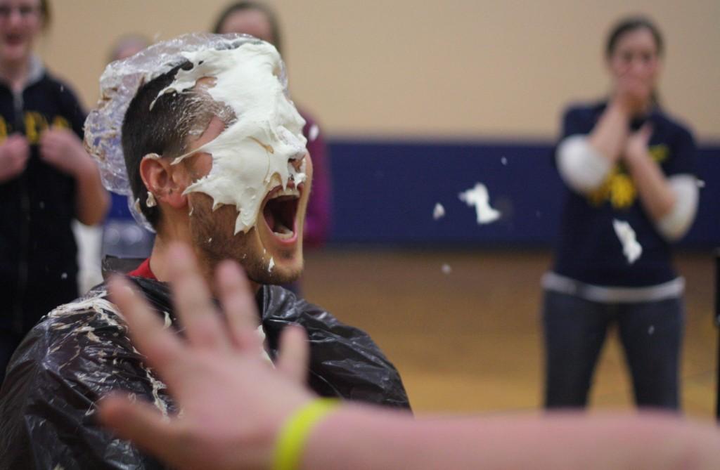 Middle+School+Gym+Teacher+Mr.+Hazel+gets+pied+in+the+face.+The+assembly+was+and+award+for+improved+MEAP+scores.+%7C+Photo+by+Linn+Benham
