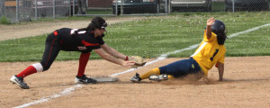 Sophomore Brittany Moore slides into base just in time and is called safe. |Photo by Michaela Post