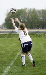 Sophomore Alyvia Hurst throws the ball back in the game. | Photo by Linn Benham 