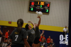 Two seventh grade volleyball players getting reader to hit the ball. |Photo by Mikayla Baese
