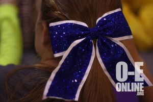 Cheerleader, Kayla Melzer, shows off her sparkly, blue  bow as a representative of breast cancer awareness during October. | Photo by Summer Rademacher