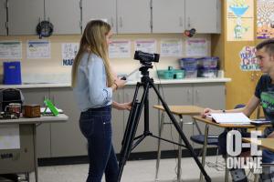 Senior Lizzy Bisson interviews other senior Gordon Johnson for the upcoming state conference in March. |Photo by Mary Ray