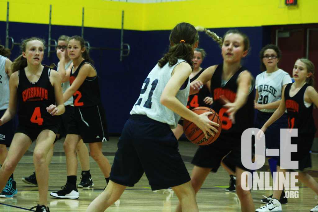 Ovid+Elsie+Middle+School+faces+Chesaning+in+girls+basketball+on+the+10th.+Number+21+looks+for+an+opening+to+score+of+point+for+her+team.+%7CPhoto+by+A.J+Larsen