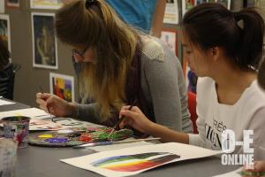Foreign exchange students Earth and Clemence work together on their projects in art class. |Photo by Alexis Underwood