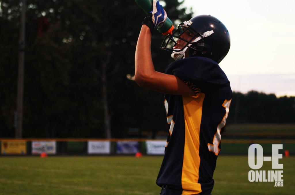 OE+JV+football+team+during+a+water+break+before+the+game+starts.+%7CPhoto+by+A.J+Larsen