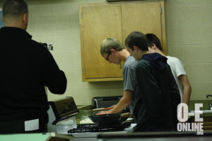 Three students in Chinese class make some food to try. |Photo by Rebecca McClure