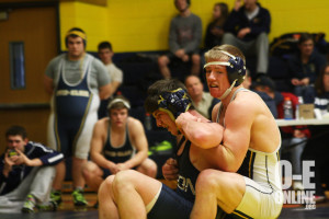 Senior Haiden West pulls his opponent down to the mat for a home meet on January 17. | Photo by Molly Maynard