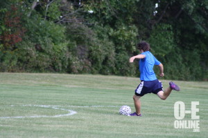 Freshman Dawson Coats kicks the soccer ball during practice. |Photo by Summer Rademacher
