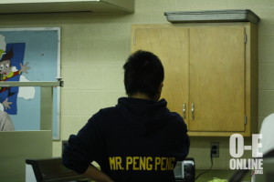 The Chinese Mr. Peng Peng teacher looks towards the wall in the Chinese classroom. |Photo by Rebecca McClure.