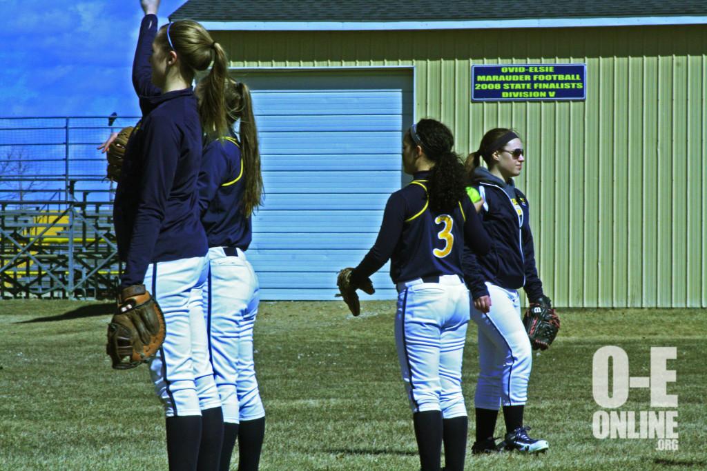 The O-E Varsity softball girls practice there throwing skills before the game. |Photo by A.J Larsen