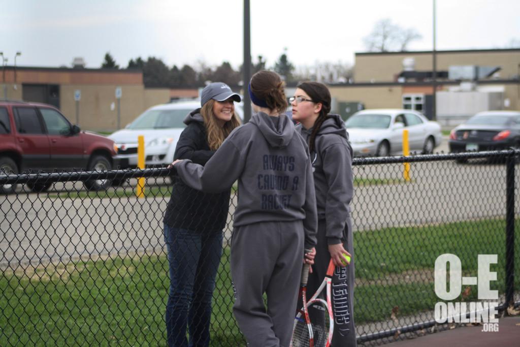 1st Doubles Grace Samson and Danyelle Frink discuss strategies with Coach Miller.| Photo by Molly Maynard